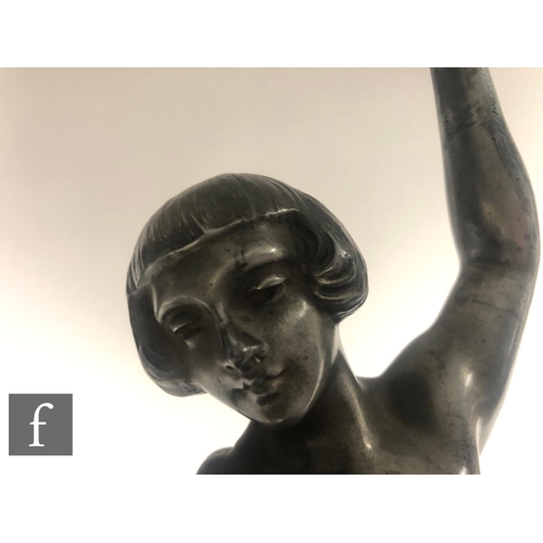 529 - After Marcel Bouraine - A large 1920s patinated bronze figure of a female dancer standing on one leg... 