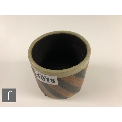 1078 - Emily Myers - Four pieces of studio pottery comprising a compressed beaker vase with painted black a... 