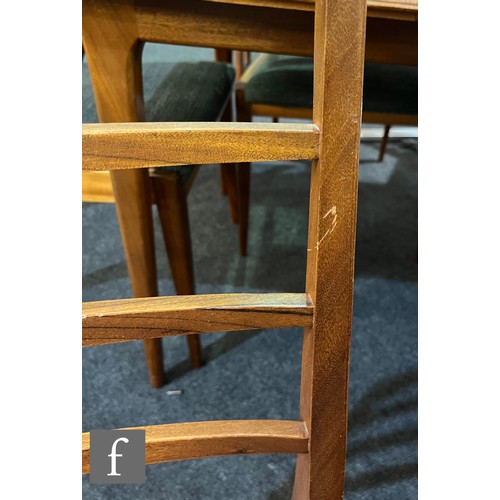 748 - Tom Robertson - McIntosh of Kirkcaldy - A teak Dunvegan dining table and six chairs, the extending t... 