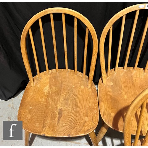 733 - Lucian Ercolani for Ercol Furniture - A set of seven Windsor elm and beech dining chairs to include ... 