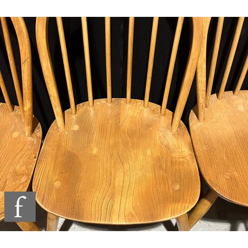 733 - Lucian Ercolani for Ercol Furniture - A set of seven Windsor elm and beech dining chairs to include ... 