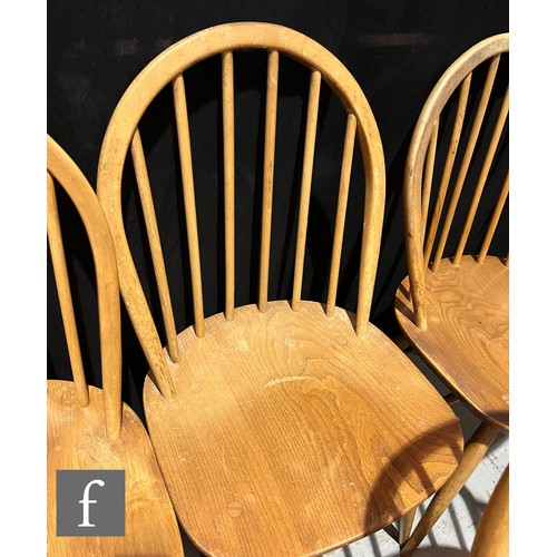 733 - Lucian Ercolani for Ercol Furniture - A set of seven Windsor elm and beech dining chairs to include ... 