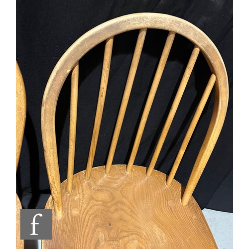 733 - Lucian Ercolani for Ercol Furniture - A set of seven Windsor elm and beech dining chairs to include ... 