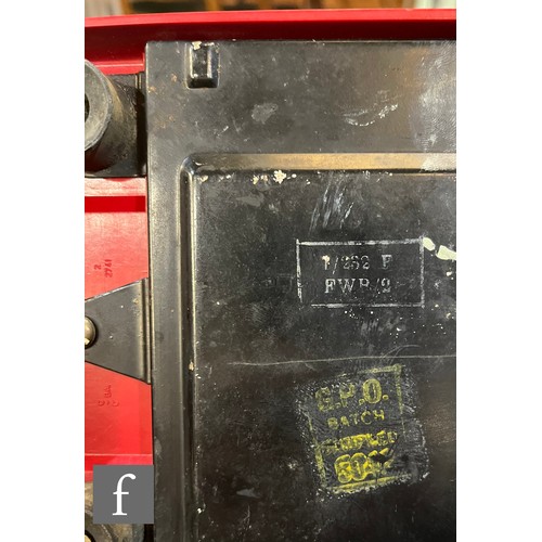 516 - G.P.O. (General Post Office) - A 'Pyramid' style  telephone in a red painted case, stamped to base w... 