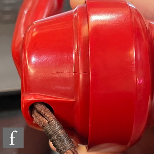 516 - G.P.O. (General Post Office) - A 'Pyramid' style  telephone in a red painted case, stamped to base w... 