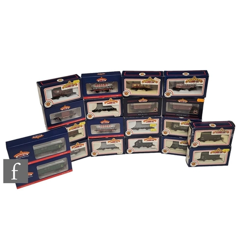 4049 - A collection of OO gauge Bachmann rolling stock, to include tank wagons, ore wagons, plank wagons, p... 