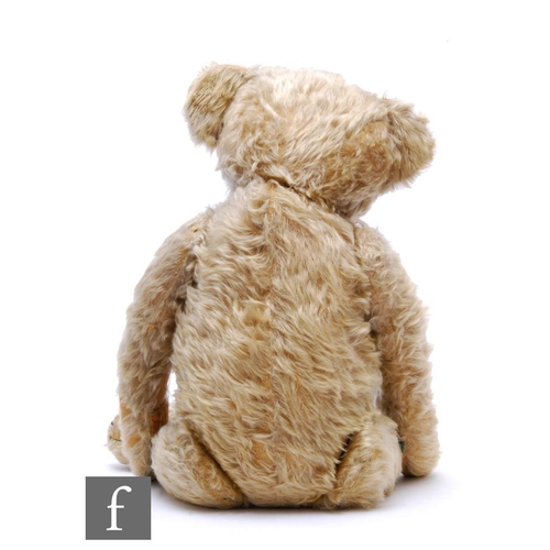 4466 - An early 20th Century English teddy bear, circa 1908, blonde mohair, boot button eyes, swivel head, ... 