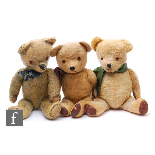 4470 - Three English teddy bears, circa 1940s, all with blonde or golden mohair and rexine paw pads, fully ... 