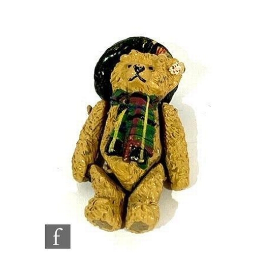 4500 - A Steiff miniature articulated pewter teddy bear, replica of Scottish Bear, wearing hat and scarf, h... 