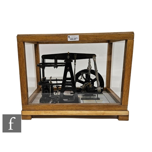 4127 - A 20th Century black painted scale model of a beam engine with spoked flywheel on simulated brick ba... 