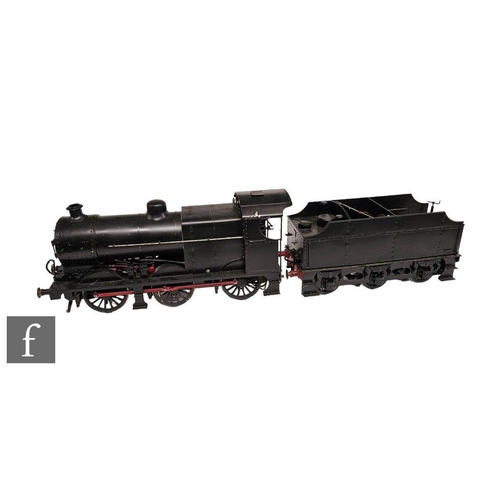 A live steam scratch built 3 1/2 inch gauge 0-6-0 locomotive finished in black livery with tender.
