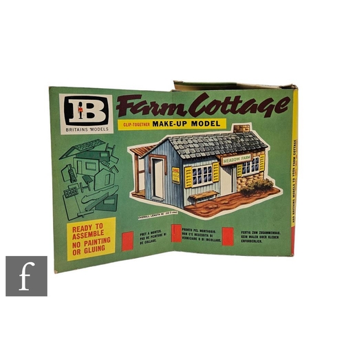 4135 - A Britains 4716 Farm Make-Up Model Farm Cottage set, in original pictorial box.