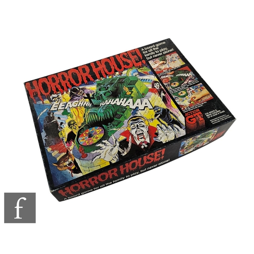 4429 - A 1980s Action GT Horror House board game, near complete, comprising board, death head wheel, six ki... 