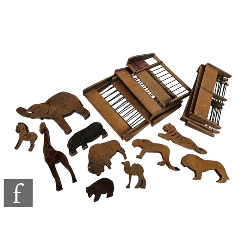 4434 - A collection of thirty seven handmade wooden zoo animals, with ten fencing sections.