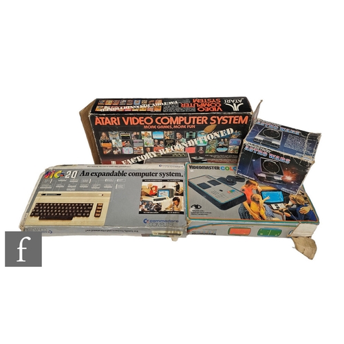 4442 - A collection of retro gaming items, comprising an Atari, a Commodore VIC20, a Videomaster Colourscor... 