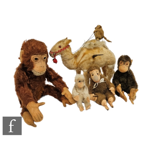 4499 - A collection of 20th Century monkey toys, including a Steiff Jocko and a clockwork monkey riding a c... 