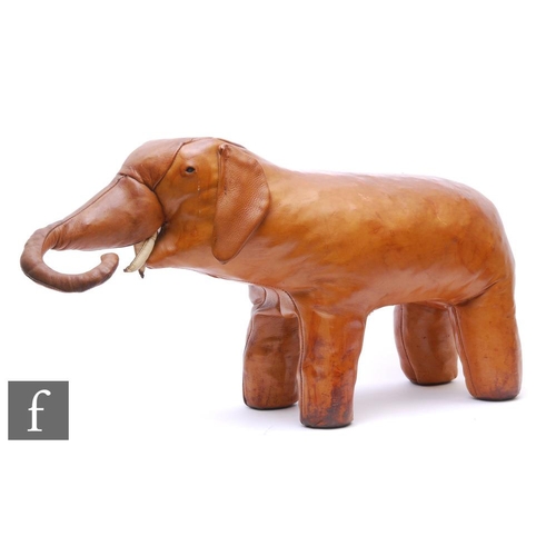 Attributed to Omersa - A tan leather foot stool in the form of an elephant, unlabelled, height 42cm and length 77cm, some wear and damage.