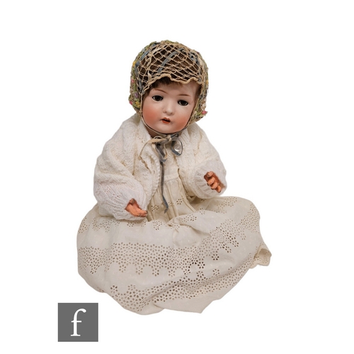 4487 - An early 20th Century Bruno Schmidt bisque socket head doll, with sleeping brown eyes with lashes, o... 