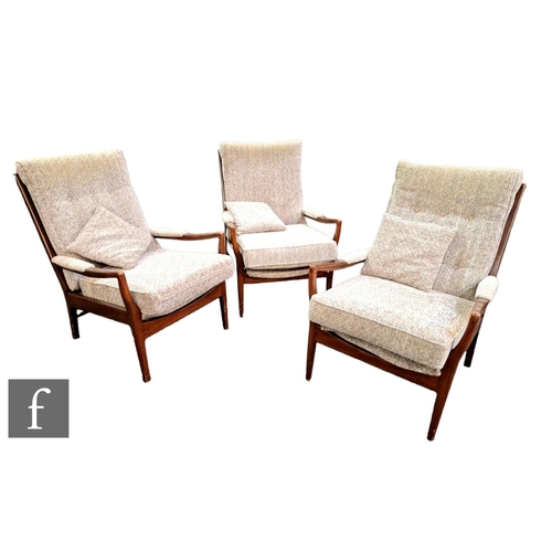 589 - Three open armchairs in the manner of Cintique, with stained beech frames, unlabelled, some scuffs t... 