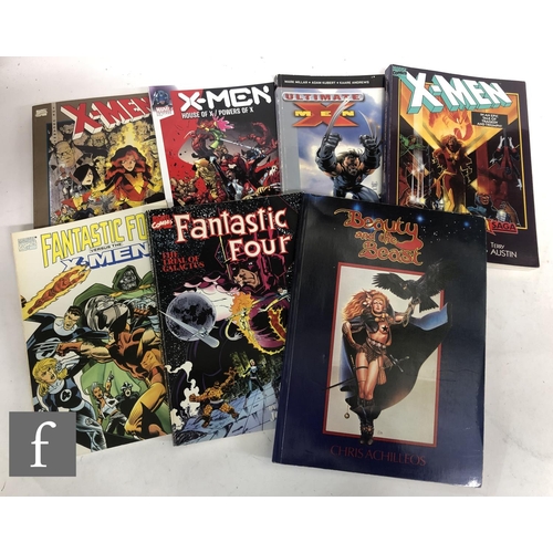 4460 - A collection of modern age comics and graphic novels to include Marvel Legends, Wolverine and Deadpo... 