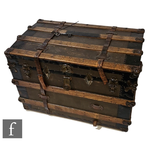 619 - A late 19th to early 20th Century travelling trunk or silver chest, of canvas bound construction wit... 