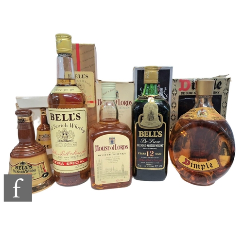 422 - A collection of Scottish whiskies, to include Dimple, Bell's 12 year old, William Whiteley & Co.... 