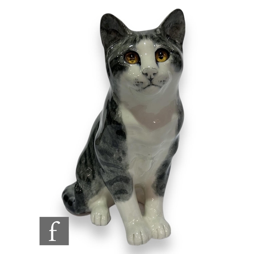 65 - A large Winstanley cat by Mike Hinton, a seated silver tabby with white face and bib, hand painted m... 