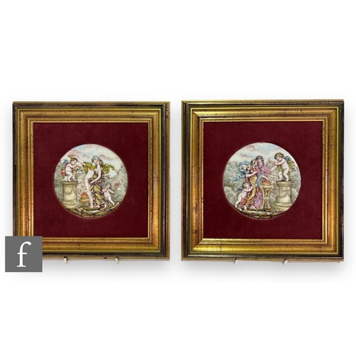 73 - A near pair of early 20th Century Italian Capodimonte porcelain plaques of circular form, each relie... 