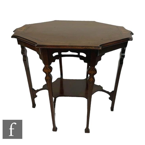 574 - An Edwardian Arts & Crafts inlaid centre table the shaped top over slender legs united by an und... 