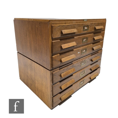 577 - A 1930s light oak plan chest, the 'Arclight', in two sections, maker's tablet by N Mason and Sons Li... 