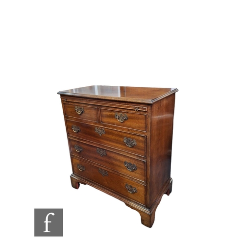 601 - A 20th Century George III style mahogany bachelor's chest, the brushing slide over two short and thr... 