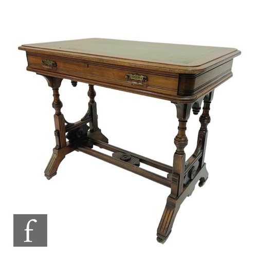 611 - A Victorian walnut writing table, the moulded edge green leather inset top over a single frieze draw... 