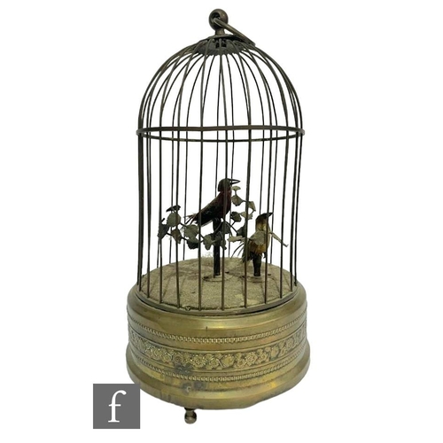 364 - An early 20th Century Griesbaum two singing birds in a brass cage, both birds move and sing, height ... 