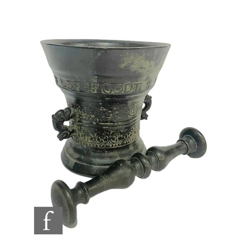 365 - A small continental bronze pestle and mortar with bands of decoration with 'LOF GODT VAN AL 1662', d... 