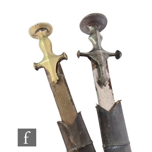 285 - A pair of Indian Tulwar swords and leather scabbards, 76cm blades (2)