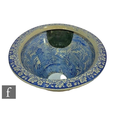 369 - A 19th Century Staffordshire blue and white toilet bowl printed with figures in a rowing boat, class... 