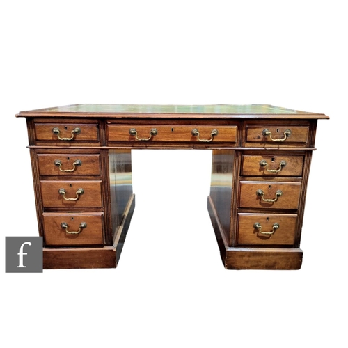 569 - A George III style mahogany kneehole desk with tooled green leather inset moulded edge top over thre... 