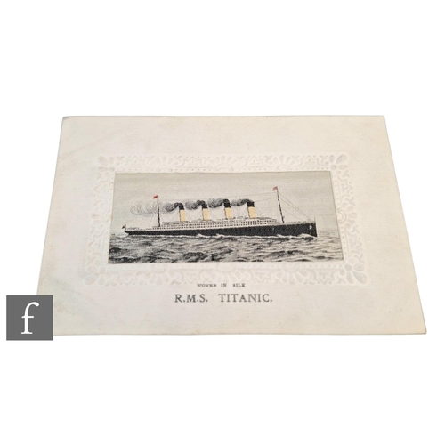 522 - An Edwardian woven silk postcard of the R.M.S Titanic within impressed floral border.NB - These card... 