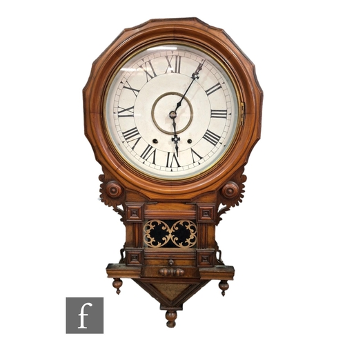 389 - A Victorian walnut wall clock, the circular white dial within a shaped inlaid border enclosed by a g... 