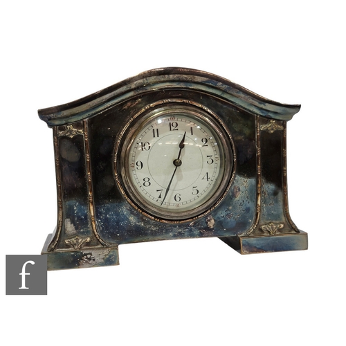 384 - An Edwardian plated mantle clock, circular white Arabic numeral dial in shaped case, width 24cm.