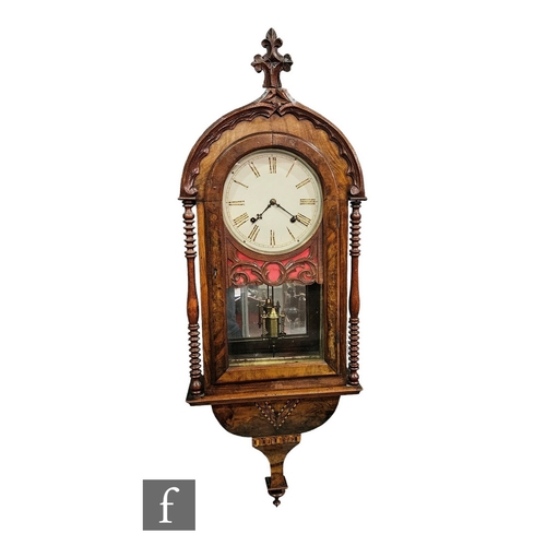 388 - A 19th Century carved domed wall clock, the circular painted dial enclosed by an arch door over a mi... 