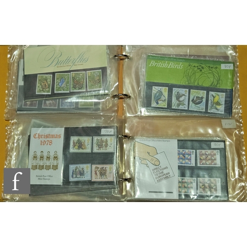 555 - A large quantity of Queen Elizabeth II Great Britain mint stamps or presentation packs and collector... 