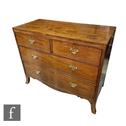 599 - A late 19th Century mahogany chest of two short and two long drawers, later brass fret handles, on s... 