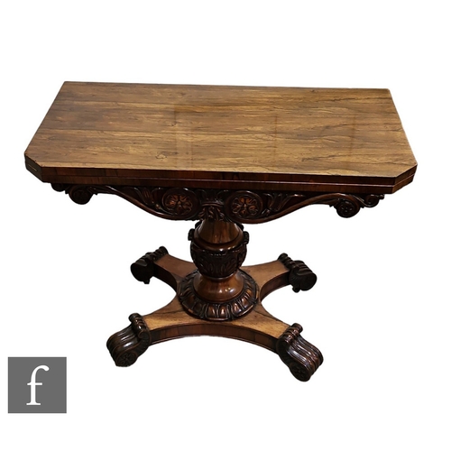 626 - A William IV rosewood fold over tea table, scroll frieze, on carved pedestal and quatrefoil base, te... 