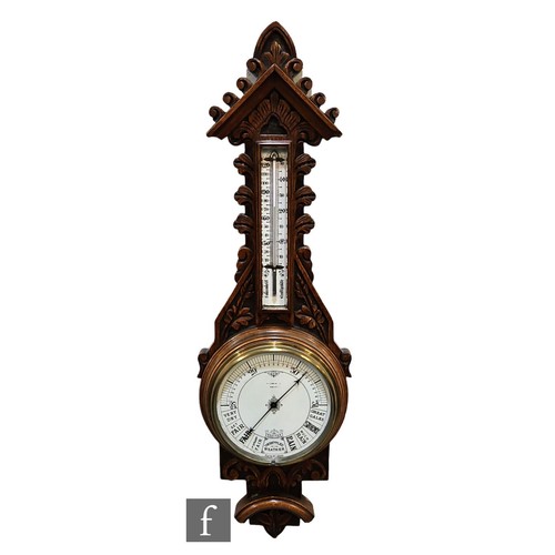 379 - A Victorian carved oak aneroid barometer incorporating thermometer, the dial Great Gales to Very Dry... 