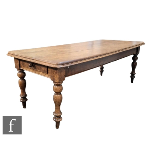 583 - A Victorian narrow oak dining table, the deep moulded edge triple panelled top over a plain frieze a... 