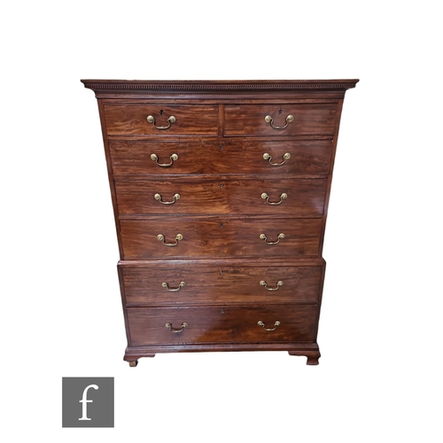 572 - A George III mahogany chest on chest, two short and three long drawers above a further two deep long... 