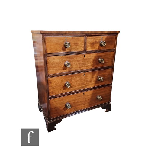 571 - A small George III crossbanded mahogany straight front chest of two short and three long drawers, ci... 