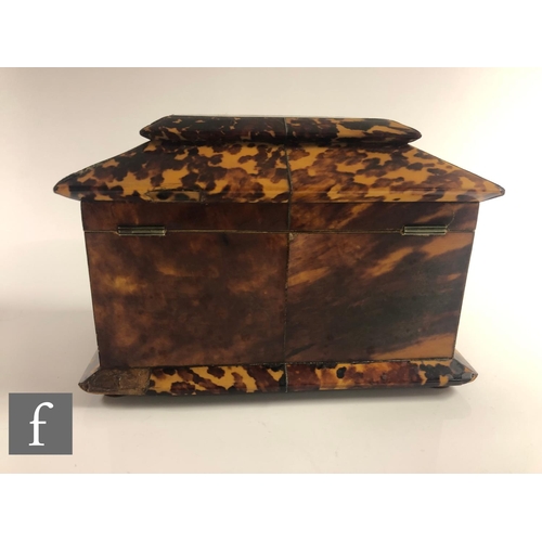 373 - An early 19th Century Regency tortoiseshell tea caddy of inverted breakfront form, inlaid with white... 