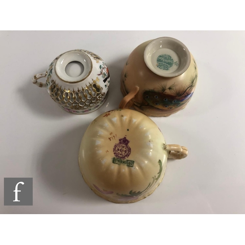 142 - A miniature Worcester reticulated cabinet cup and saucer, the double walled cup with reticulated out... 